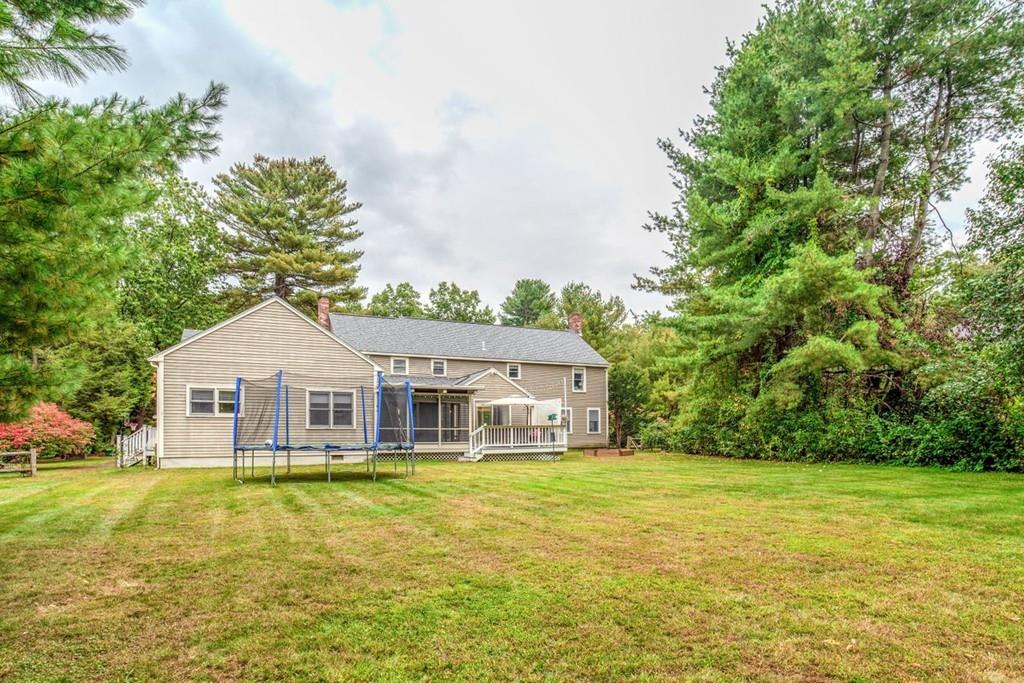 89 Shadow Oak Drive Sudbury, MA 01776 - Photo 30 of 31 a house with swimming pool in front of it