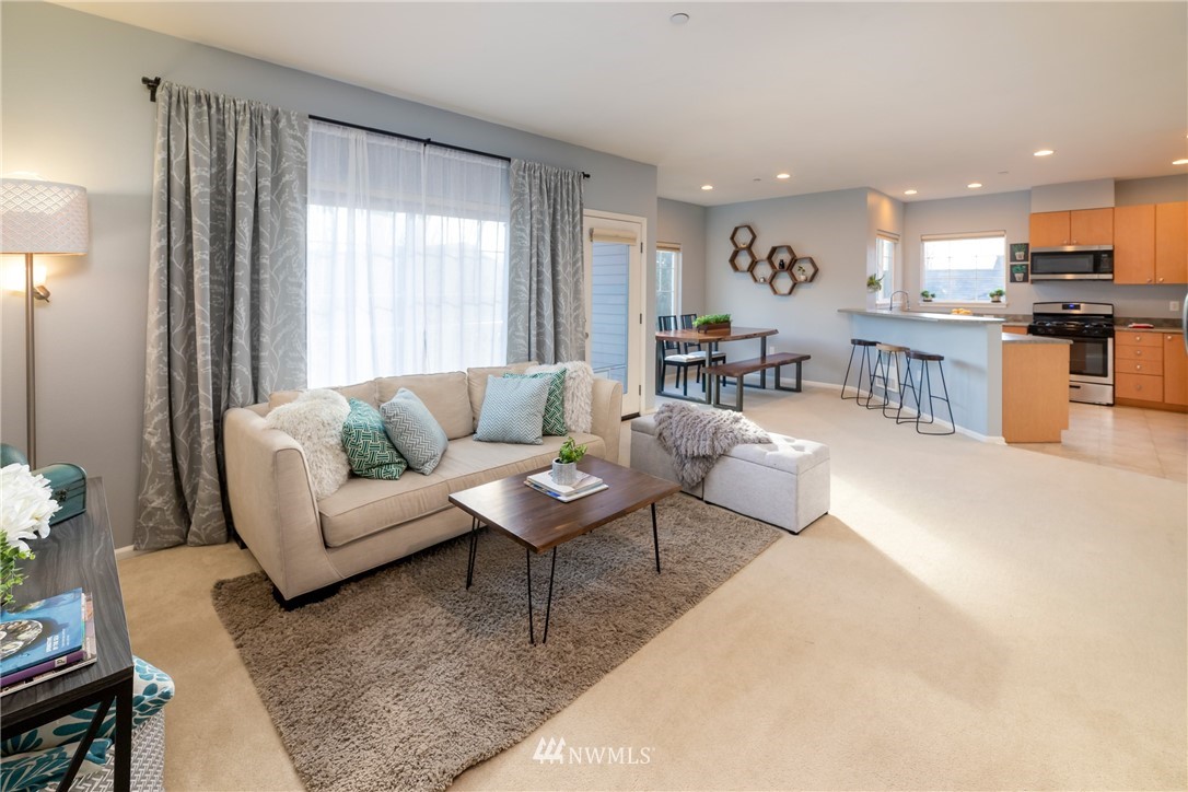 214 South 48th Street, Unit 45B Renton, WA 98055 - Photo 13 of 30 a living room with furniture and a large window