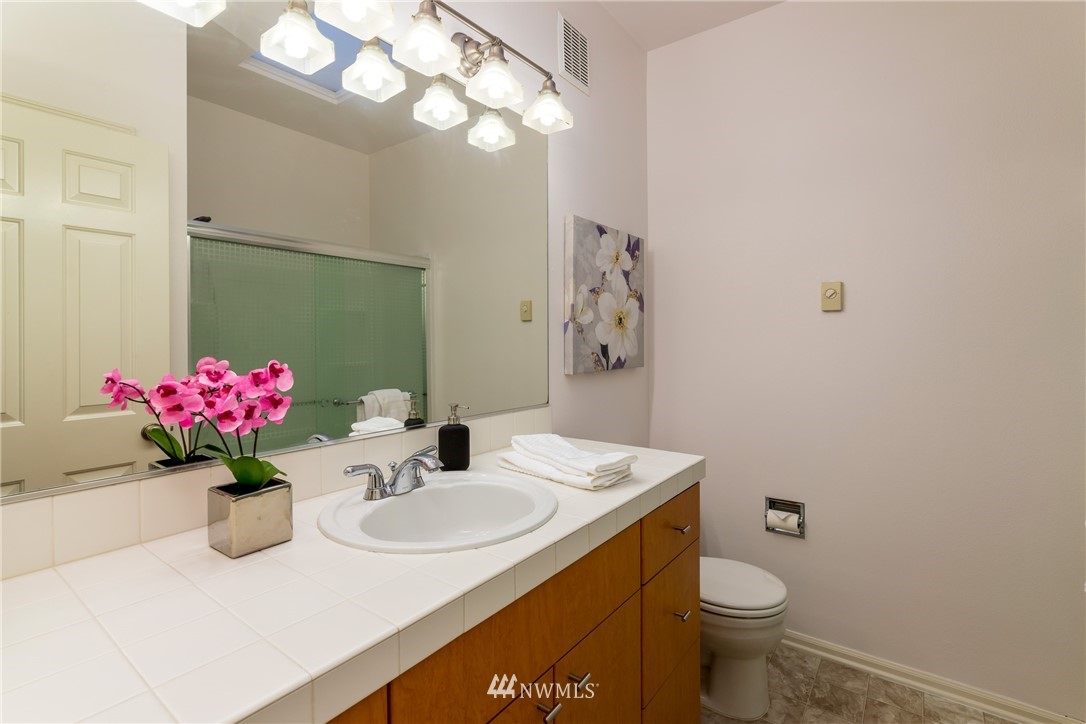 214 South 48th Street, Unit 45B Renton, WA 98055 - Photo 17 of 30 a bathroom with a sink vanity and a toilet