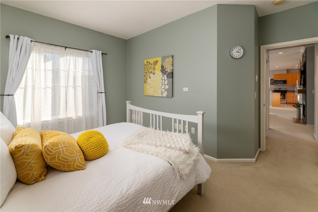 214 South 48th Street, Unit 45B Renton, WA 98055 - Photo 18 of 30 a bedroom with a bed and a window