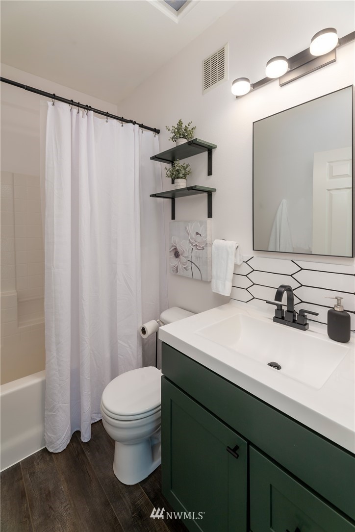 214 South 48th Street, Unit 45B Renton, WA 98055 - Photo 20 of 30 a bathroom with a sink toilet and shower