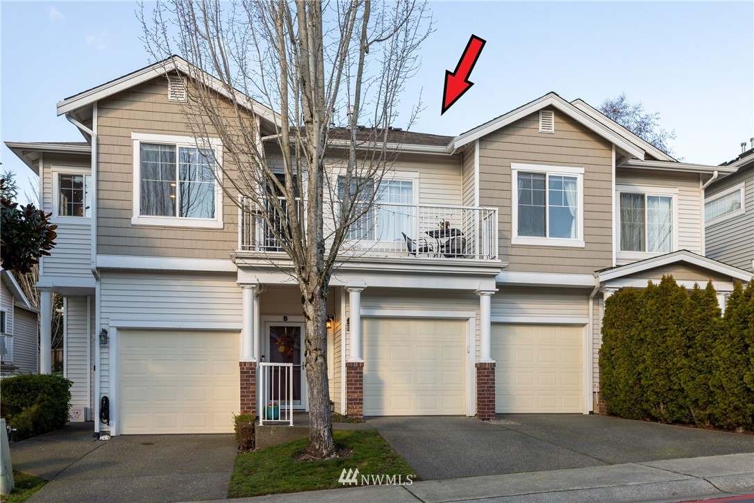 214 South 48th Street, Unit 45B Renton, WA 98055 - Photo 24 of 30 a front view of a house with a yard and garage