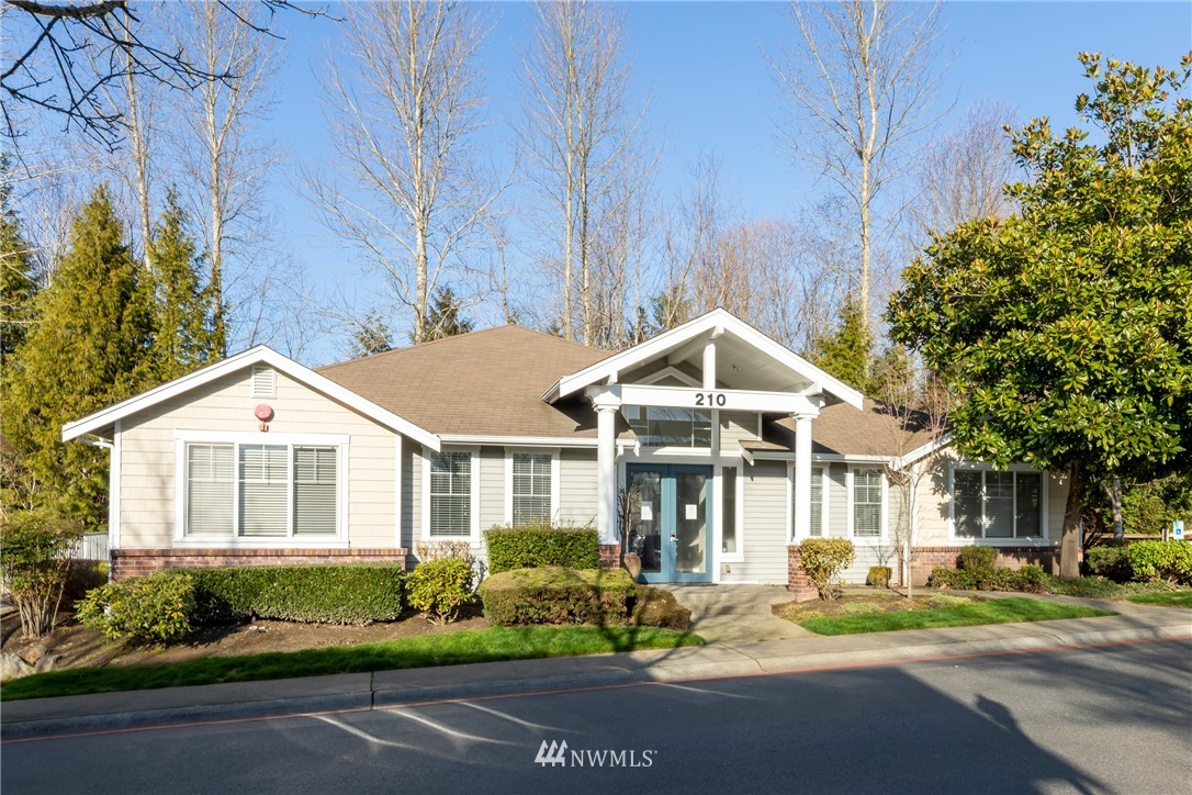 214 South 48th Street, Unit 45B Renton, WA 98055 - Photo 26 of 30 a front view of a house with a yard and outdoor seating