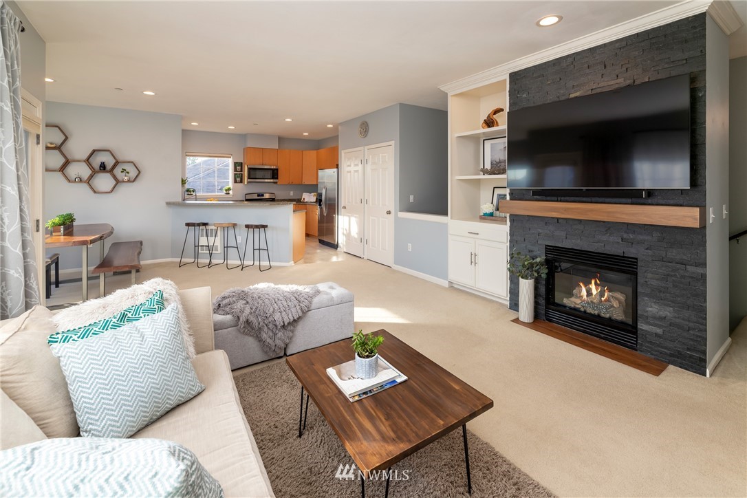 214 South 48th Street, Unit 45B Renton, WA 98055 - Photo 7 of 30 a living room with furniture and a fireplace