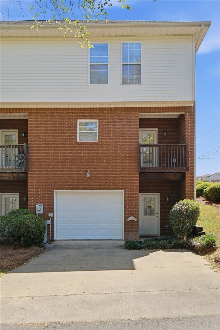 1213 North Dean Road Auburn, AL 36830 - Photo 18 of 18 This multi-level residence features a private garage with additional driveway parking.