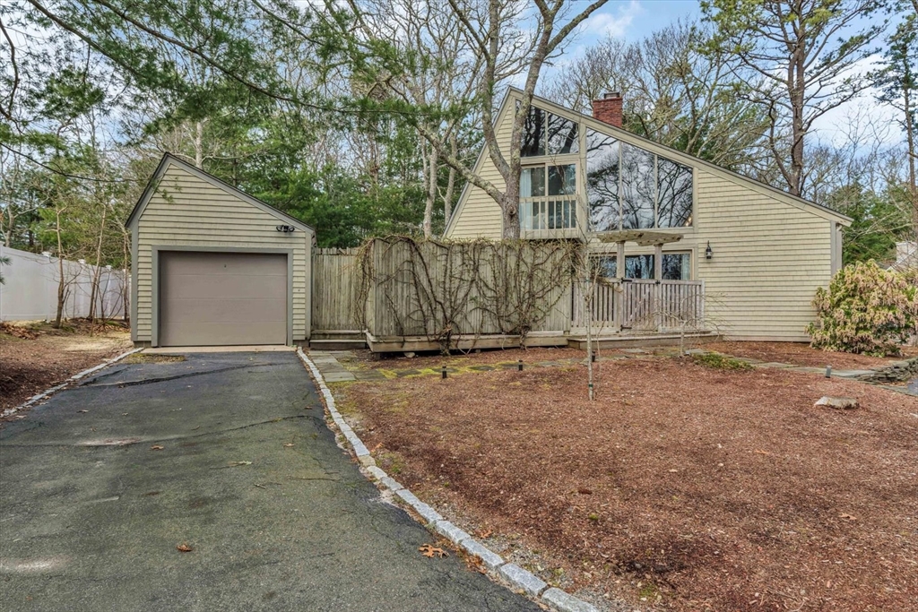 97 Fells Pond Road Mashpee, MA 02649 - Photo 1 of 40 a view of a house with a yard