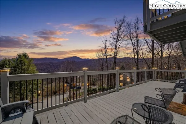 a view of a balcony with chairs