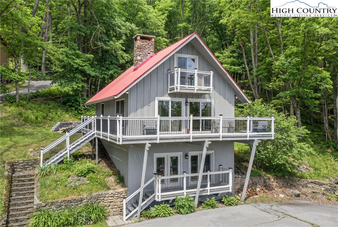 431 Cliffside Lane Seven Devils, NC 28604 - Photo 2 of 46 a view of a house with a yard