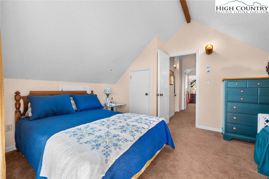 431 Cliffside Lane Seven Devils, NC 28604 - Photo 21 of 46 a bed room with a bed and a dresser