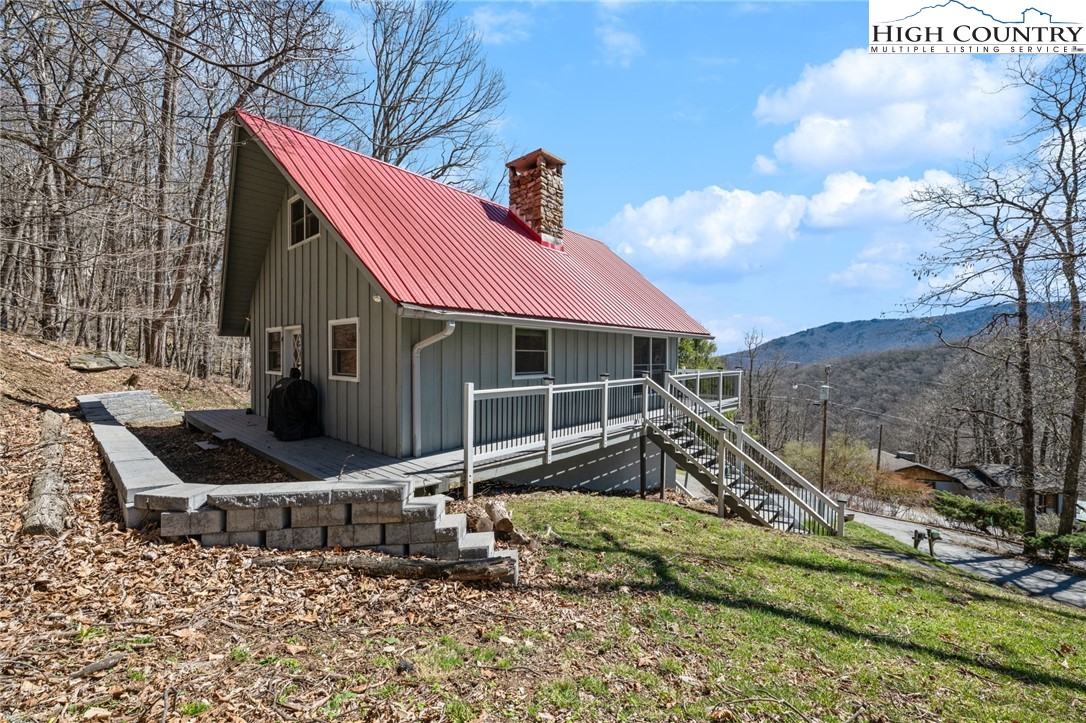 431 Cliffside Lane Seven Devils, NC 28604 - Photo 39 of 46 a front view of a house with a yard