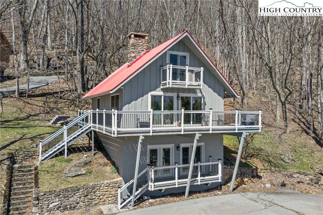 431 Cliffside Lane Seven Devils, NC 28604 - Photo 41 of 46 a view of a house with a roof deck