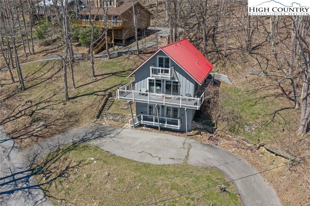 431 Cliffside Lane Seven Devils, NC 28604 - Photo 42 of 46 a view of a house with a yard