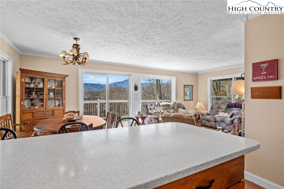 431 Cliffside Lane Seven Devils, NC 28604 - Photo 9 of 46 a view of a room with gym equipment