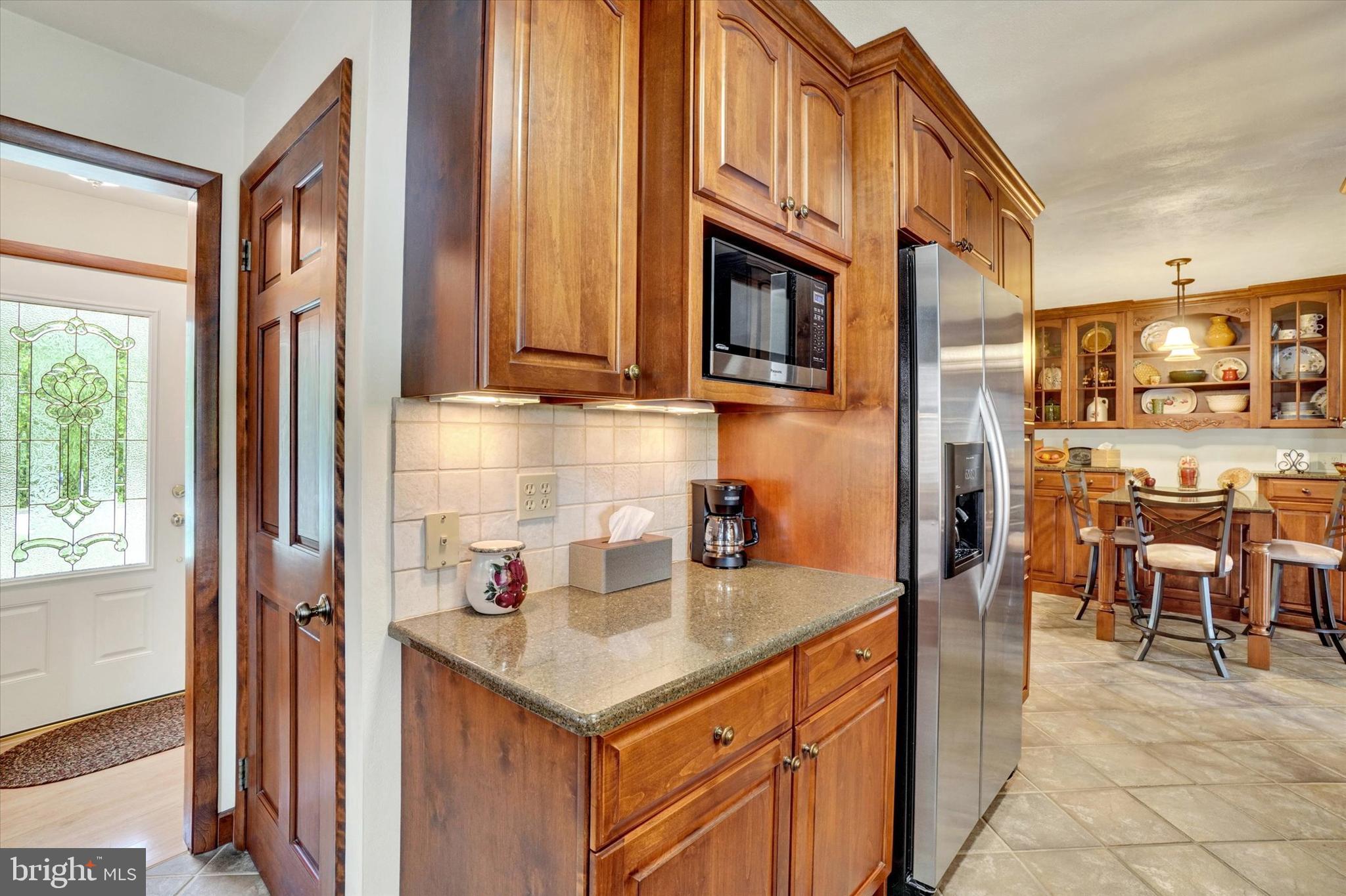 285 South Main Street Mount Wolf, PA 17347 - Photo 11 of 34 a kitchen with stainless steel appliances granite countertop a sink and a refrigerator