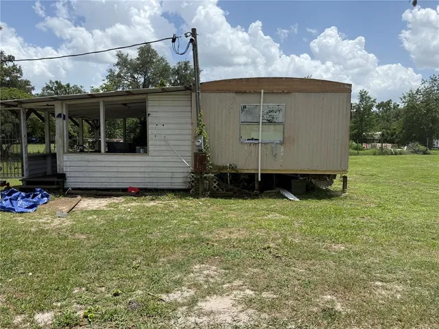 a view of backyard with cabin