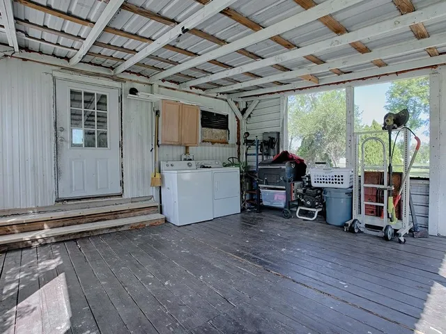 a view of a room with wooden furniture and roof