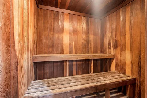 a bathroom with a shower and a sink