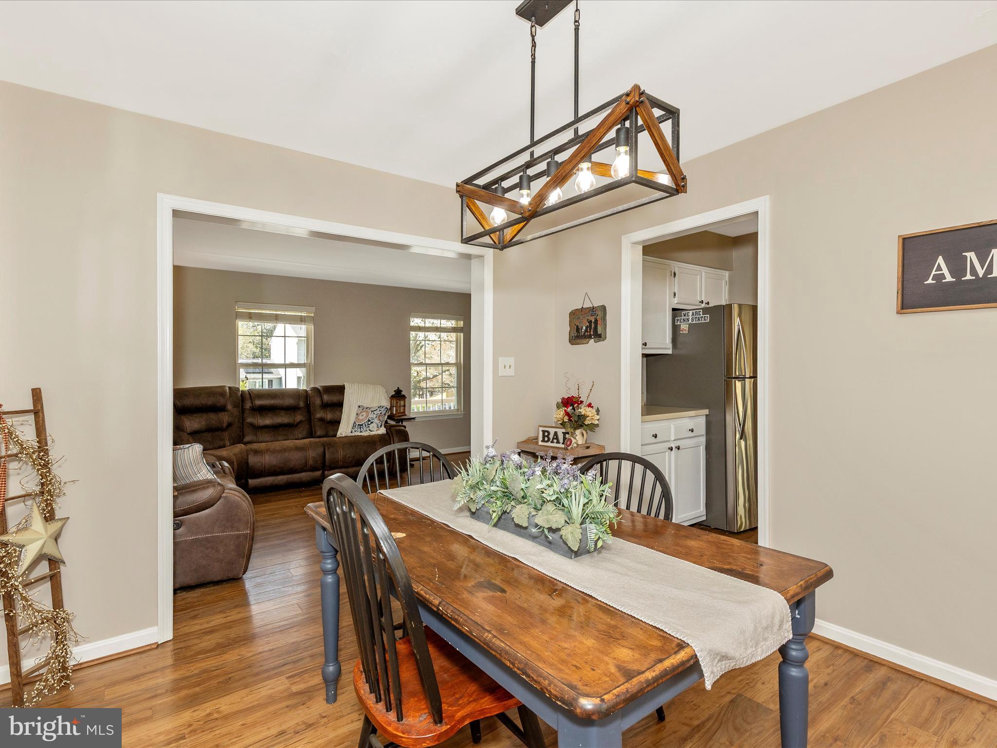 3935 Brittany Lane Hampstead, MD 21074 - Photo 11 of 55 a view of a dining room with furniture and wooden floor