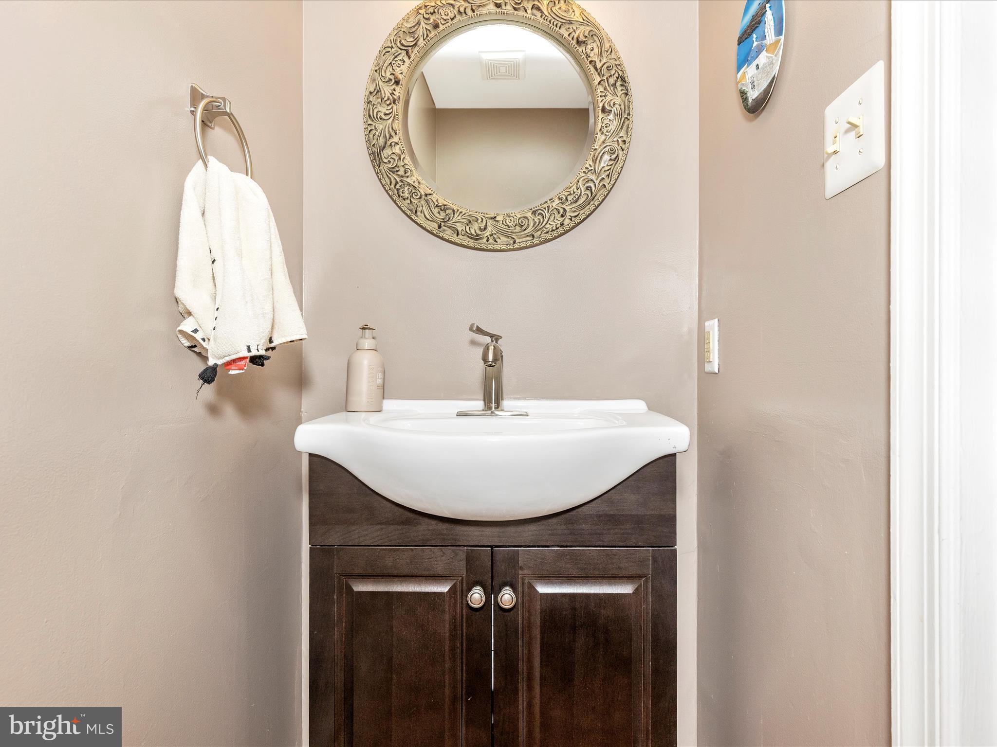 3935 Brittany Lane Hampstead, MD 21074 - Photo 13 of 55 a bathroom with a sink and a mirror