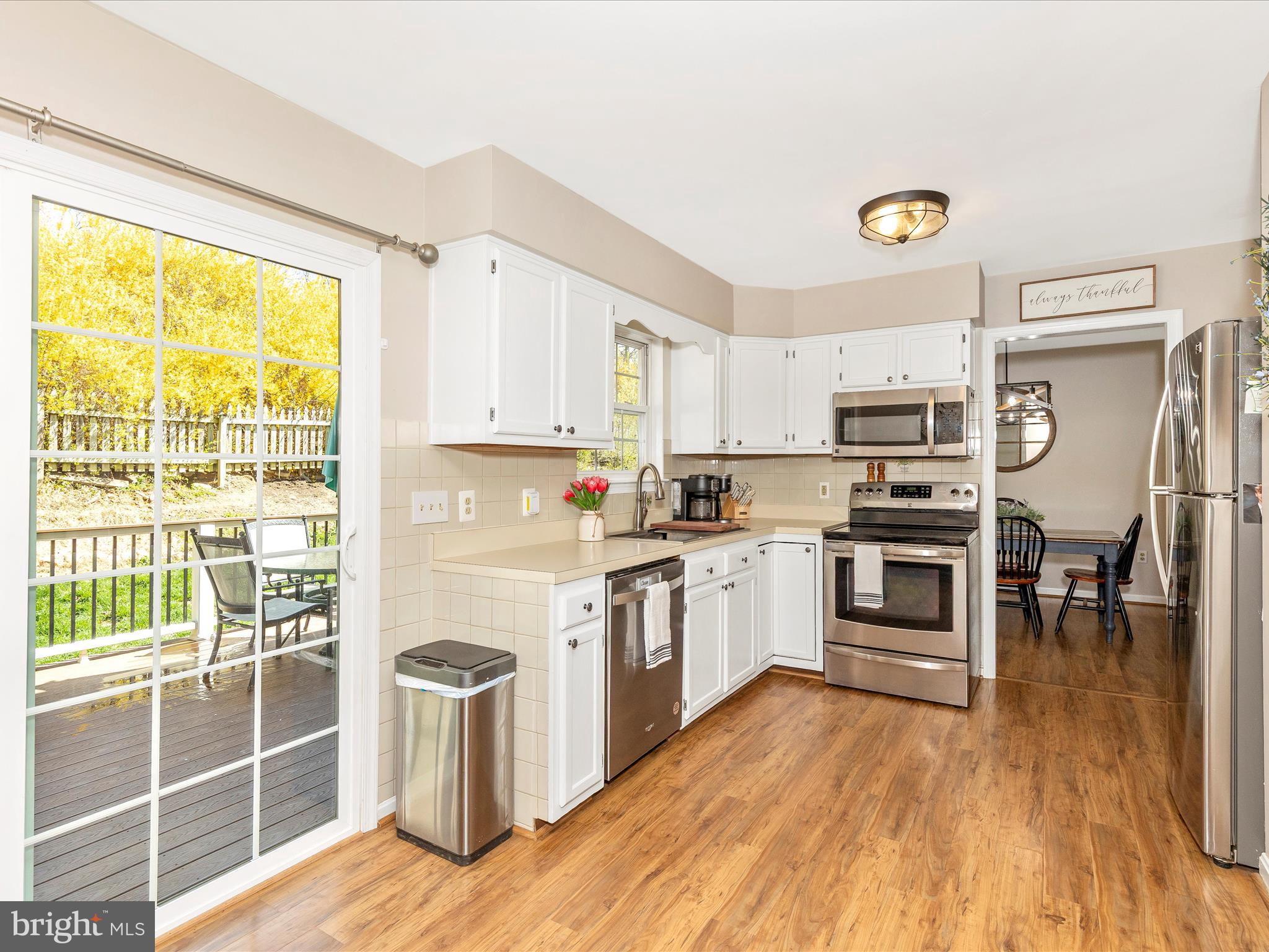 3935 Brittany Lane Hampstead, MD 21074 - Photo 14 of 55 a kitchen with a sink appliances and cabinets