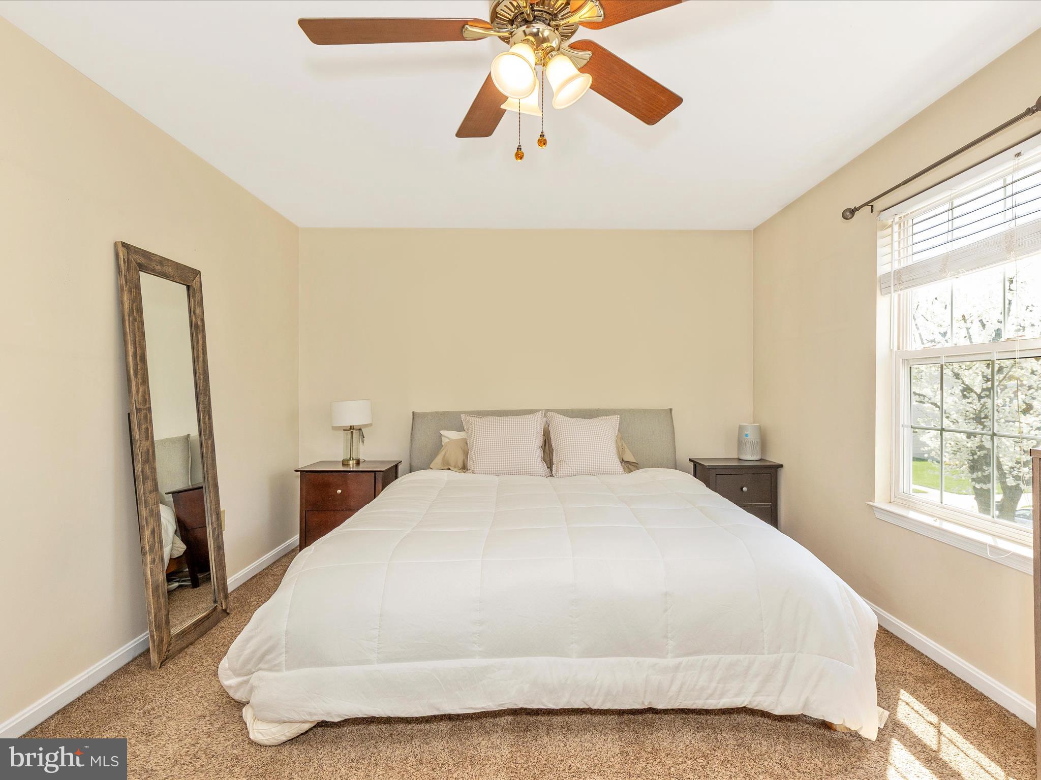 3935 Brittany Lane Hampstead, MD 21074 - Photo 21 of 55 a bedroom with a bed and a chandelier