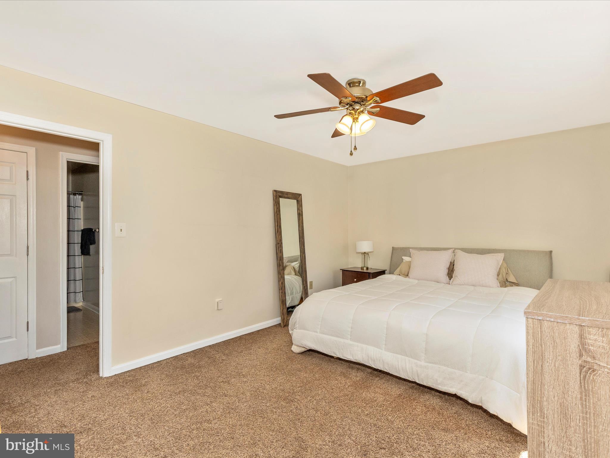 3935 Brittany Lane Hampstead, MD 21074 - Photo 22 of 55 a bedroom with a bed and a ceiling fan
