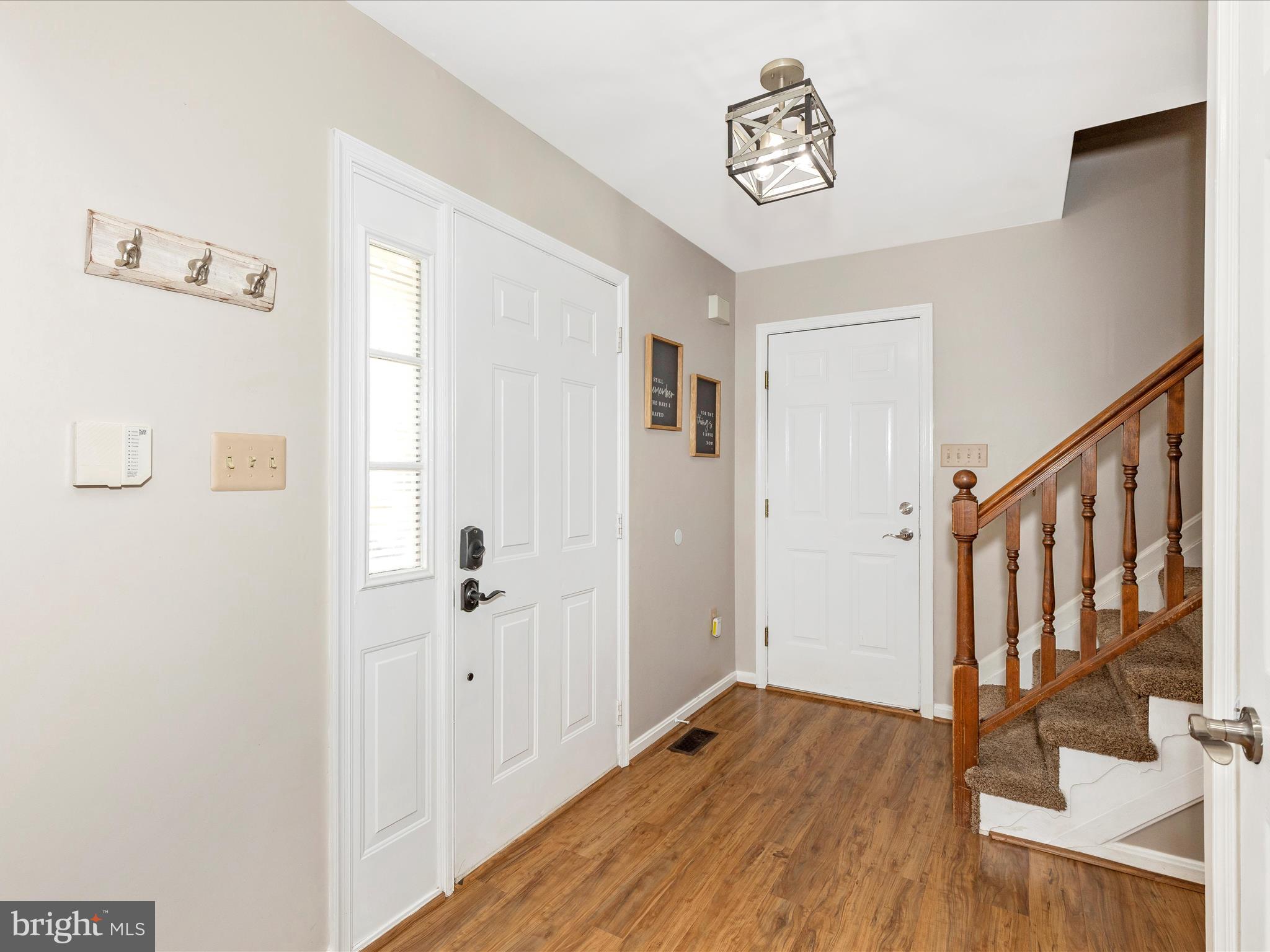 3935 Brittany Lane Hampstead, MD 21074 - Photo 3 of 55 a view of an entryway with wooden floor