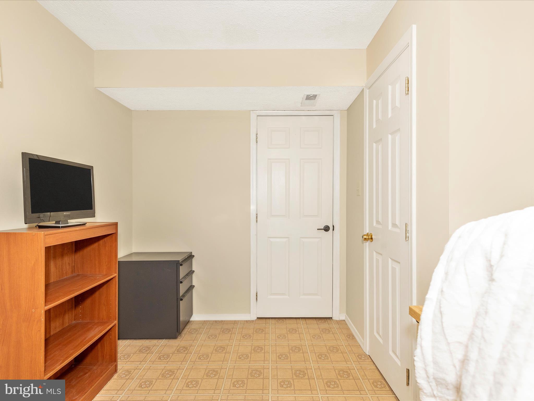 3935 Brittany Lane Hampstead, MD 21074 - Photo 34 of 55 a view of a livingroom with wooden floor and a flat screen tv