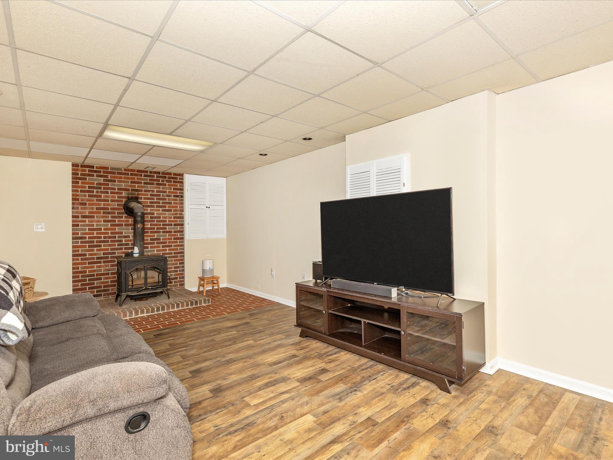 3935 Brittany Lane Hampstead, MD 21074 - Photo 36 of 55 a living room with furniture and a flat screen tv