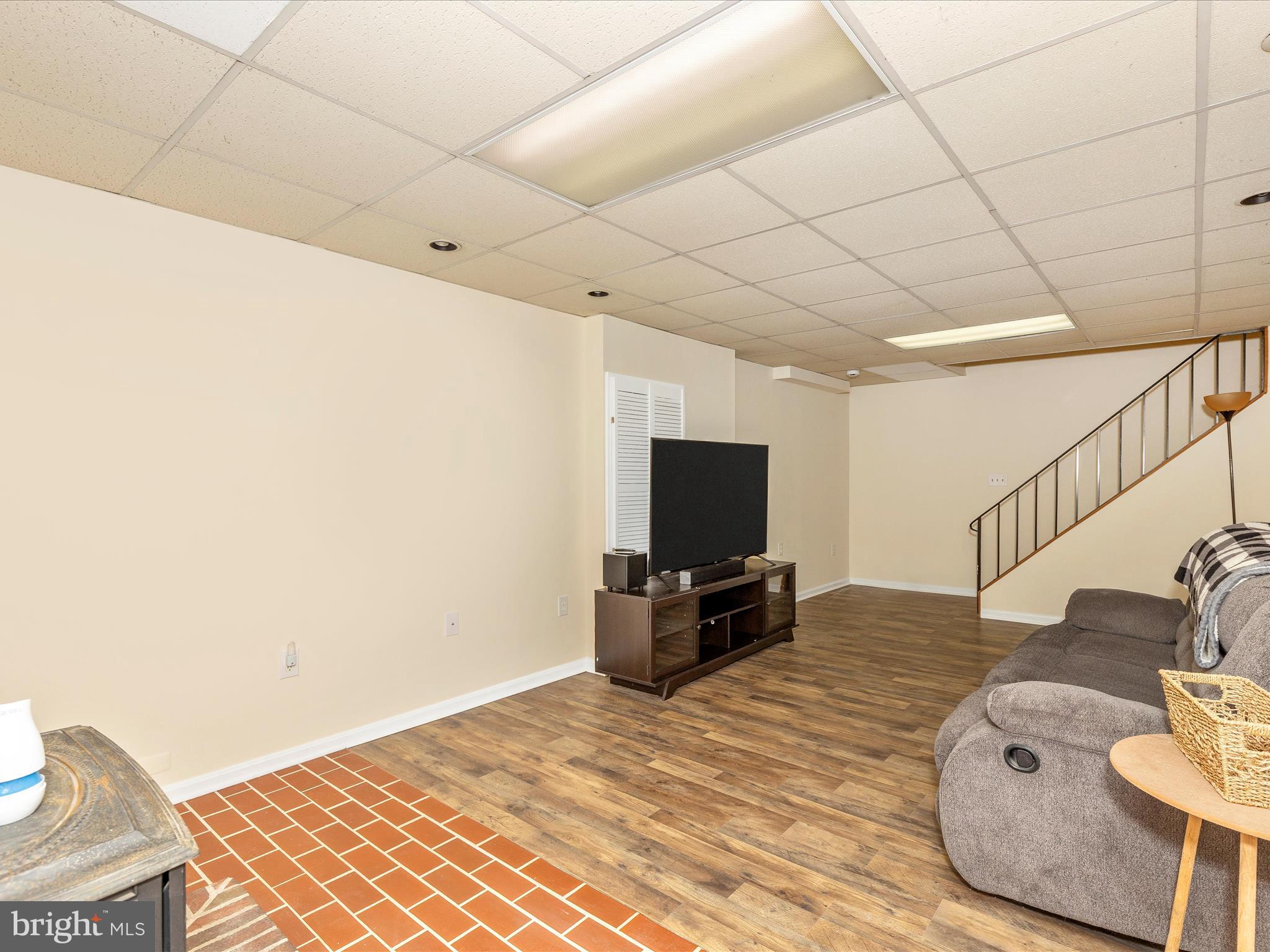 3935 Brittany Lane Hampstead, MD 21074 - Photo 37 of 55 a bedroom with a bed and a flat screen tv