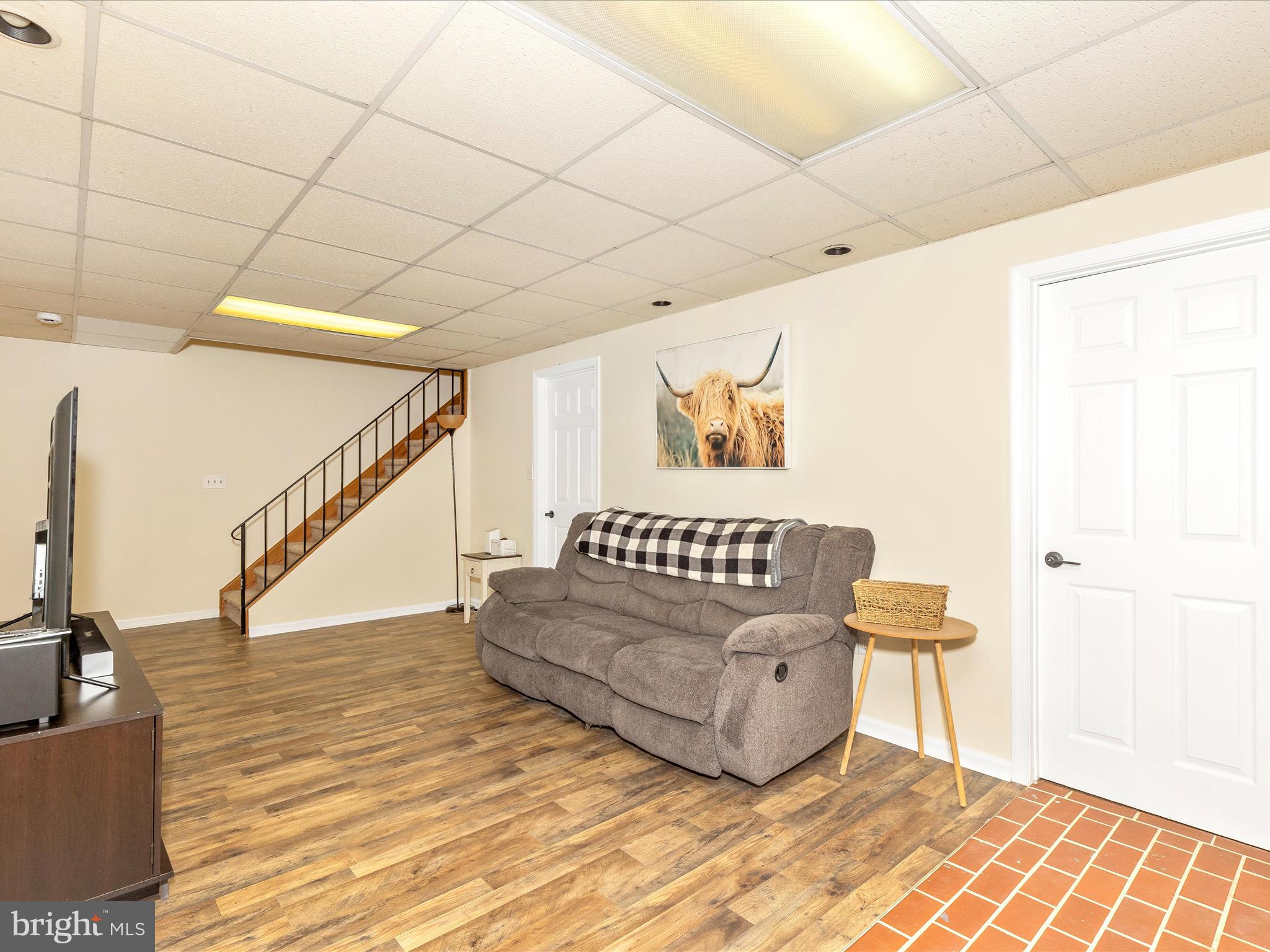 3935 Brittany Lane Hampstead, MD 21074 - Photo 38 of 55 a living room with furniture and a wooden floor