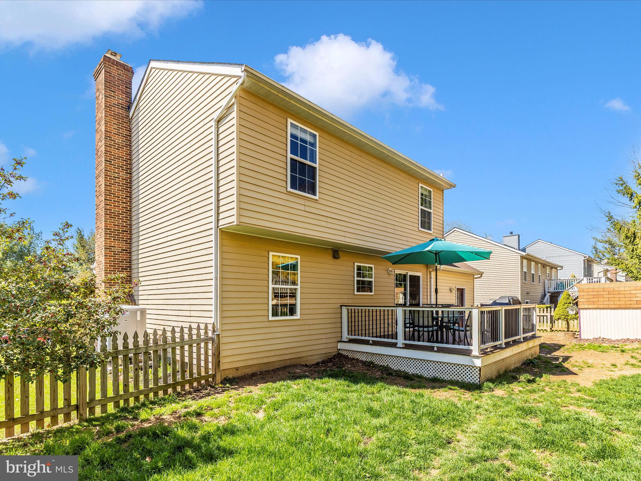 3935 Brittany Lane Hampstead, MD 21074 - Photo 49 of 55 a backyard of a house with a garden and deck