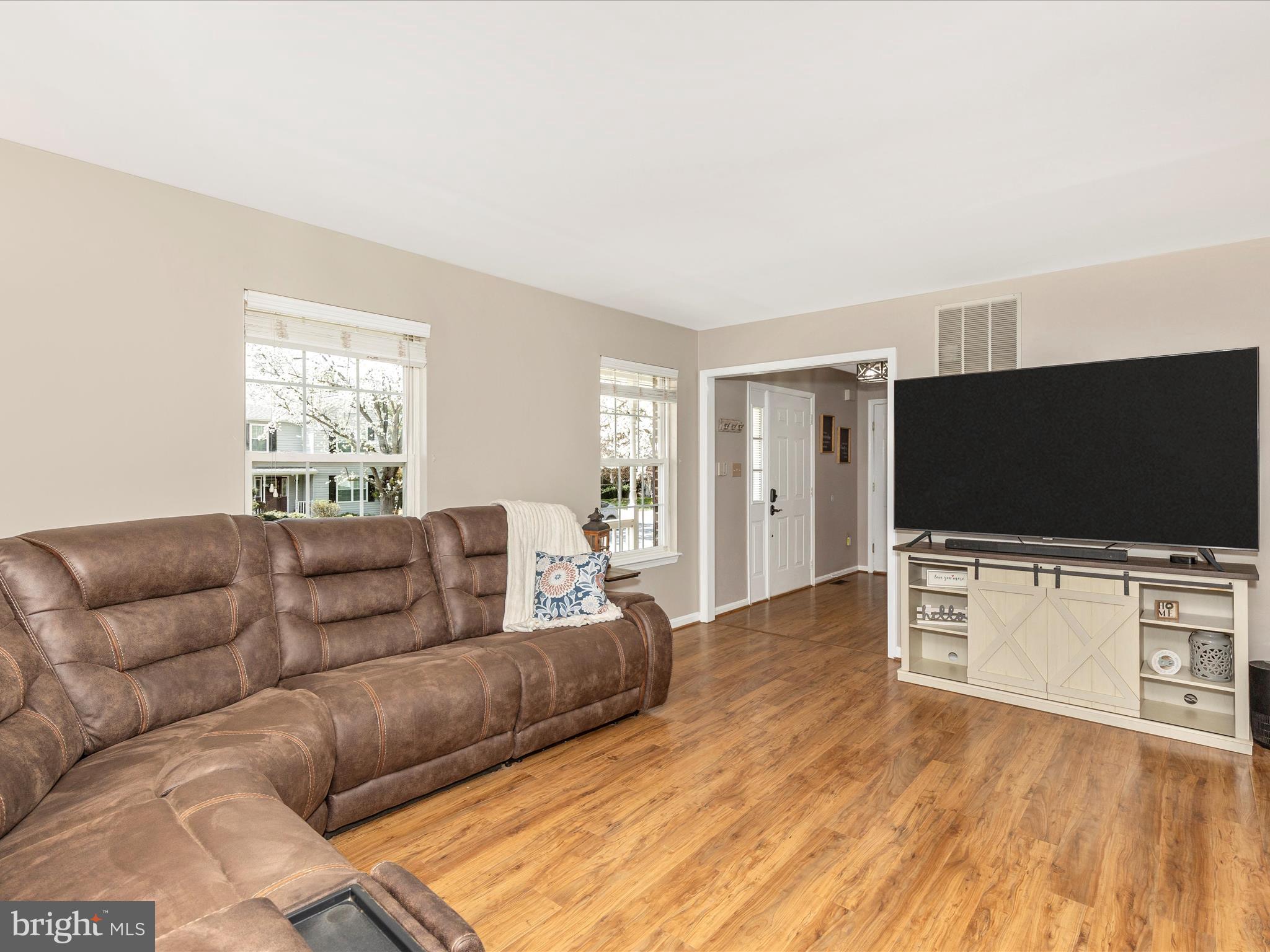 3935 Brittany Lane Hampstead, MD 21074 - Photo 8 of 55 a living room with furniture and a flat screen tv