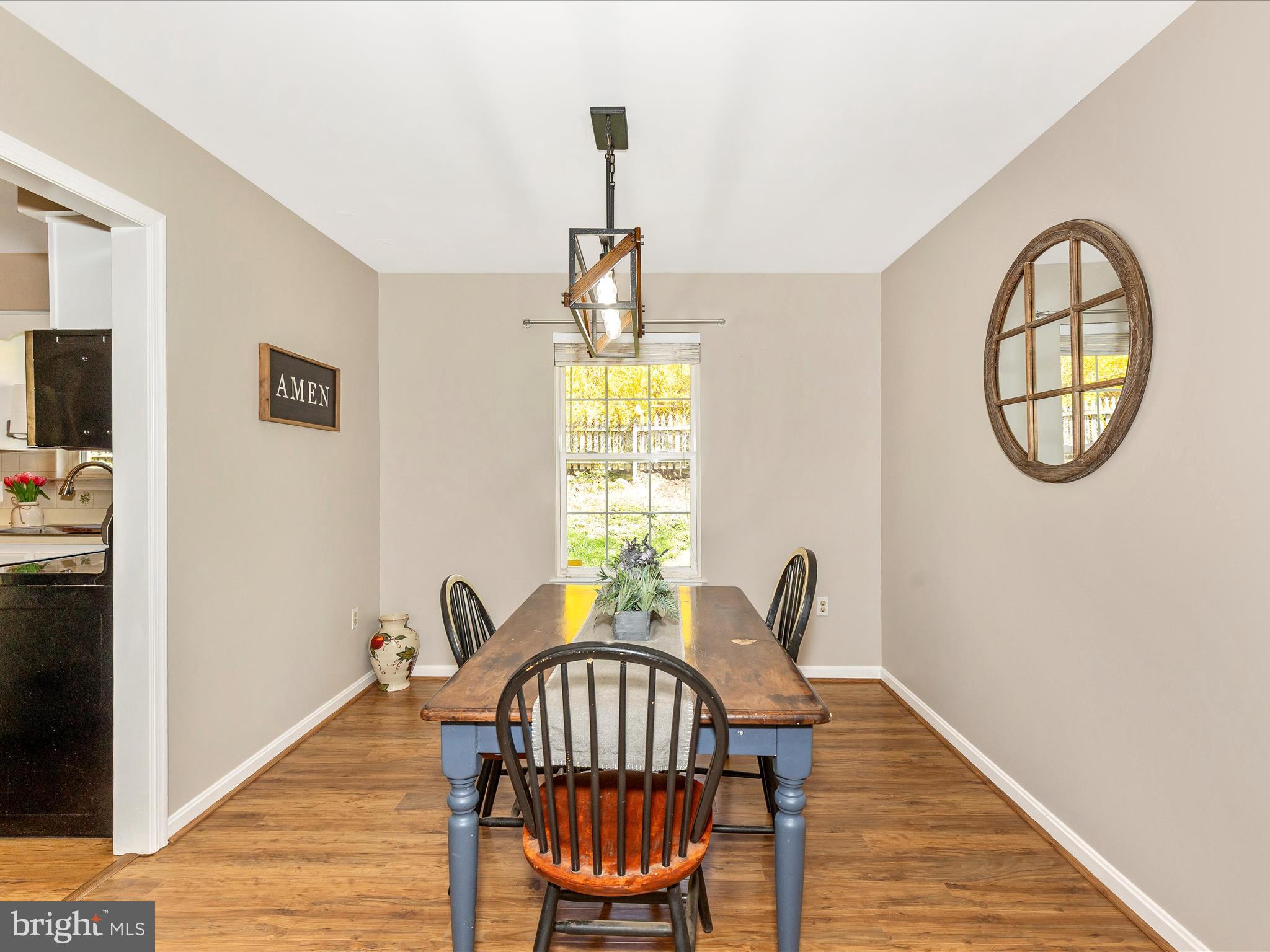 3935 Brittany Lane Hampstead, MD 21074 - Photo 9 of 55 a view of a dining room with furniture window and wooden floor