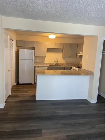 a bedroom with a bed and a table in it