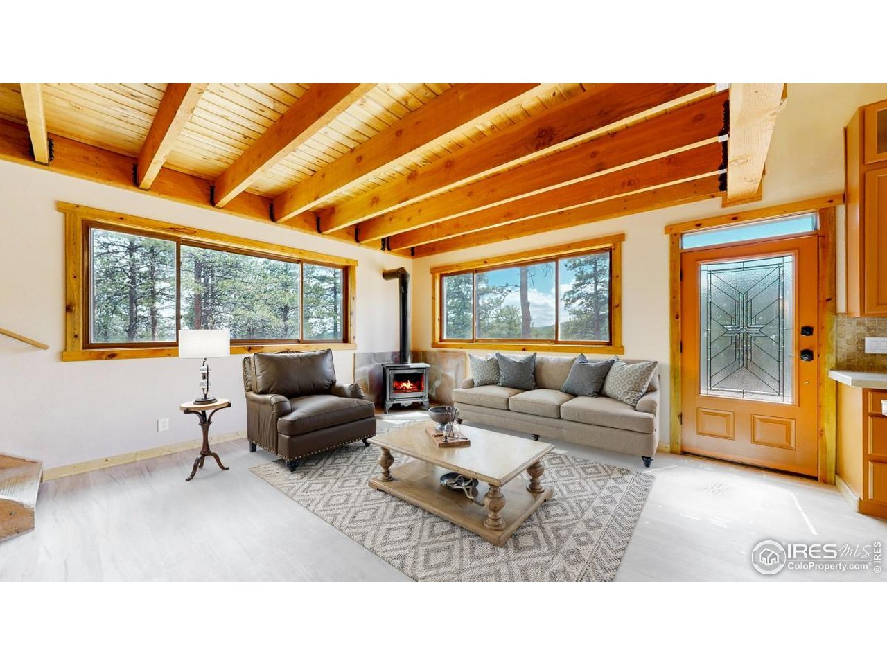 598 Taylor Road Lyons, CO 80540 - Photo 3 of 32 a living room with furniture and a large window