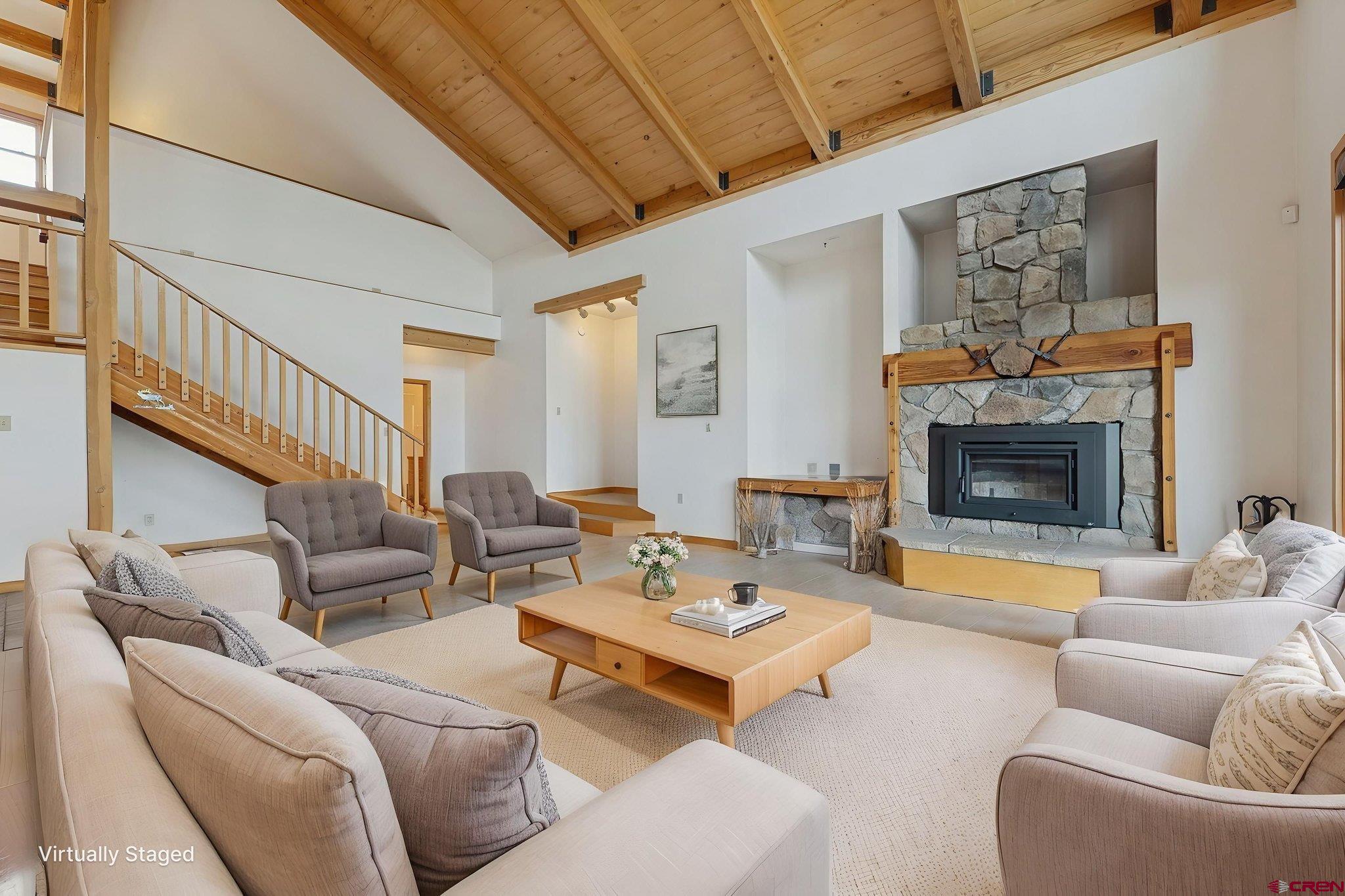 481 Far View Road Durango, CO 81303 - Photo 12 of 45 a living room with furniture and a fireplace