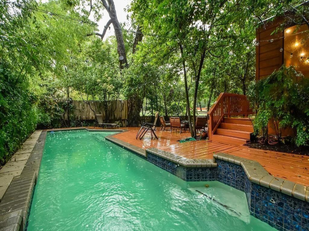 800 Leonard Street Austin, TX 78705 - Photo 1 of 31 a view of a backyard with swimming pool