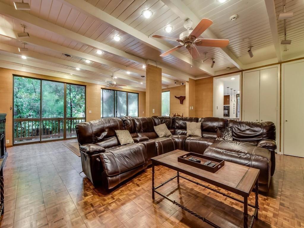 800 Leonard Street Austin, TX 78705 - Photo 15 of 31 a living room with furniture a large window with kitchen view