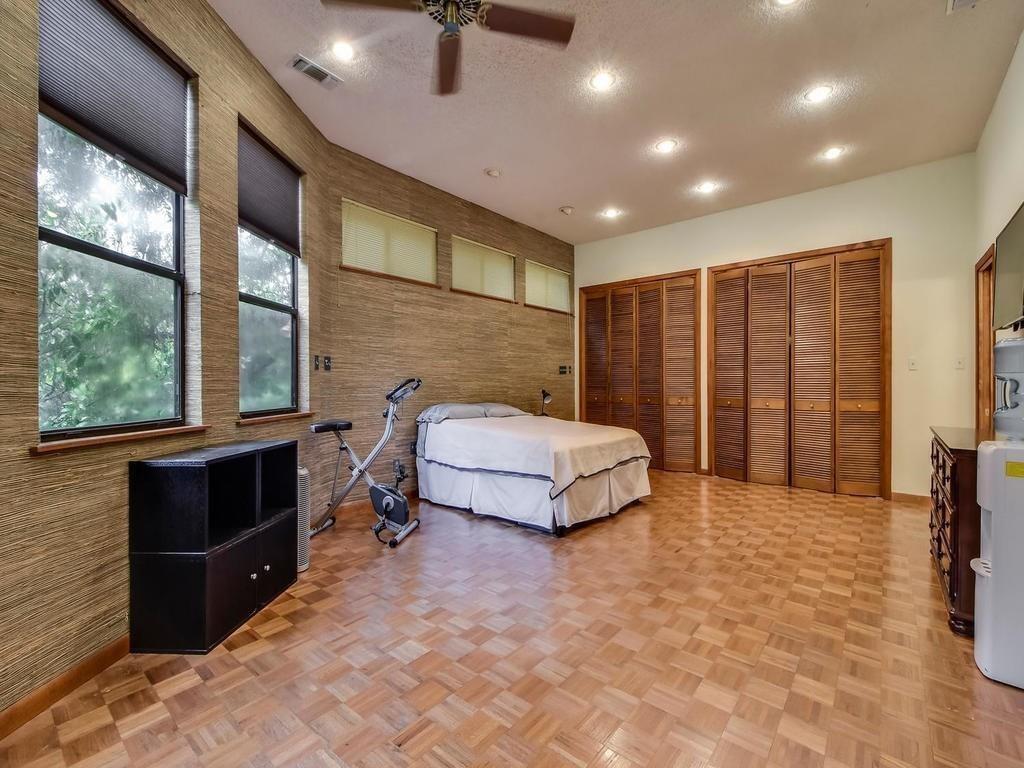 800 Leonard Street Austin, TX 78705 - Photo 16 of 31 a spacious bedroom with a bed and a large window