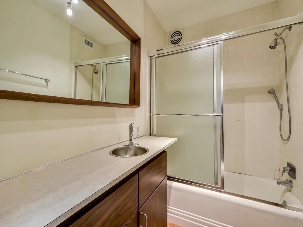 800 Leonard Street Austin, TX 78705 - Photo 22 of 31 a bathroom with a sink and a shower