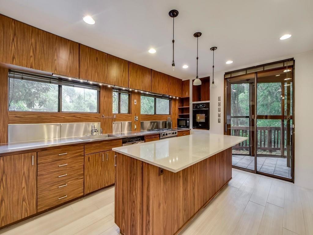 800 Leonard Street Austin, TX 78705 - Photo 24 of 31 a large kitchen with kitchen island a large island in it