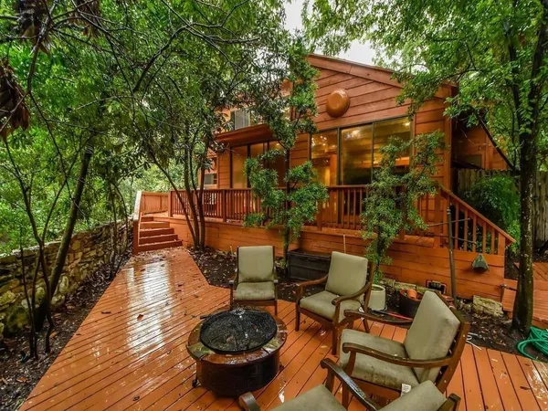 a balcony with wooden floor and outdoor space