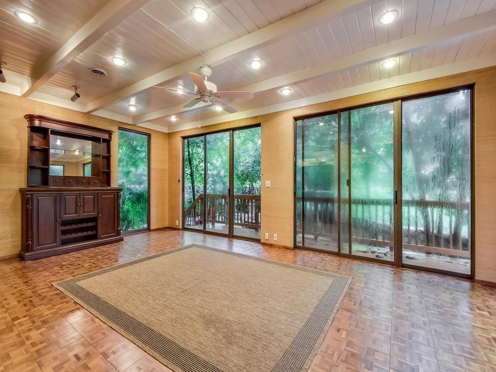 800 Leonard Street Austin, TX 78705 - Photo 7 of 31 a view of an empty room with a fireplace and a large window