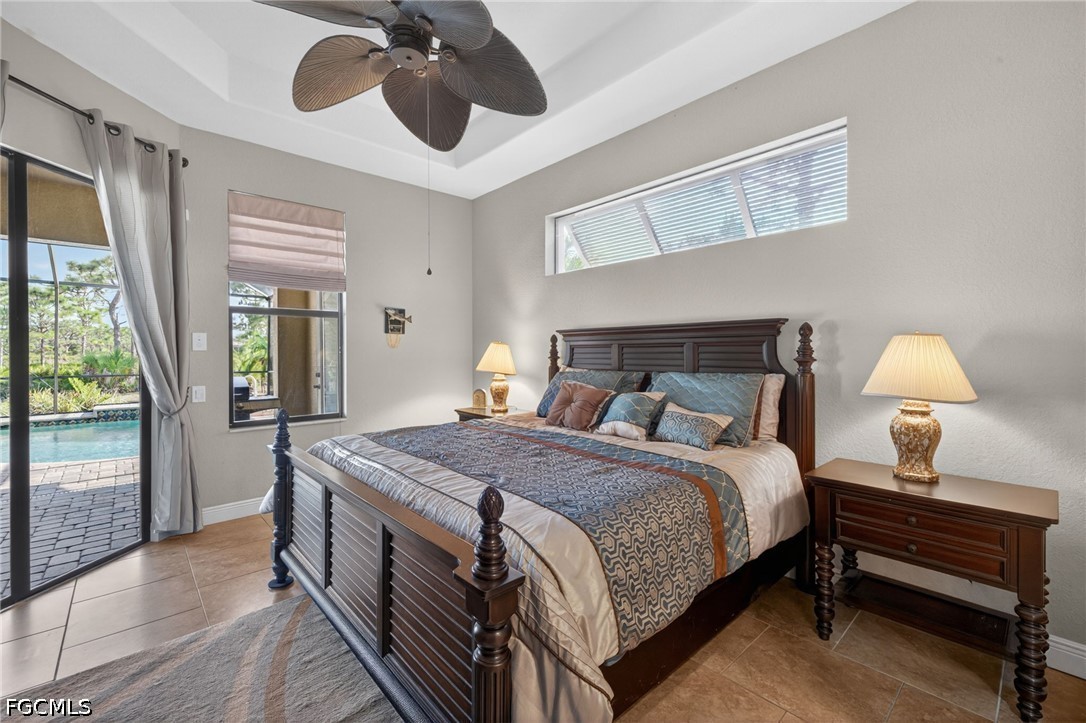 6109 Calusa Rdg Trail Bokeelia, FL 33922 - Photo 25 of 48 a bedroom with a bed and wooden floor
