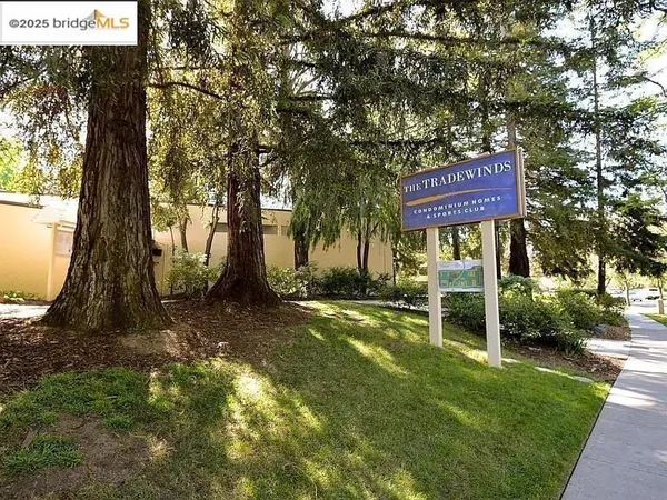 a sign board with a yard