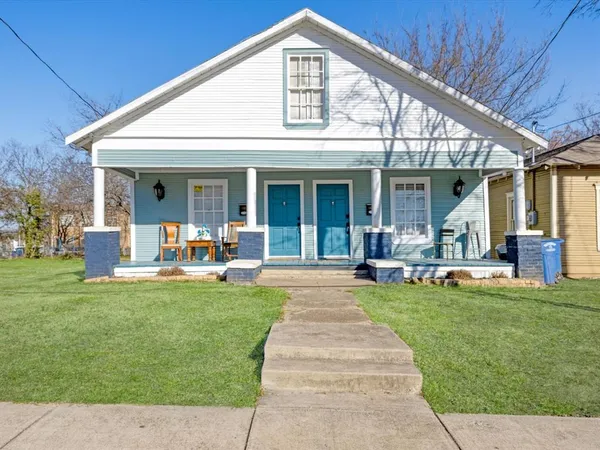 a front view of a house with swimming pool patio and yard