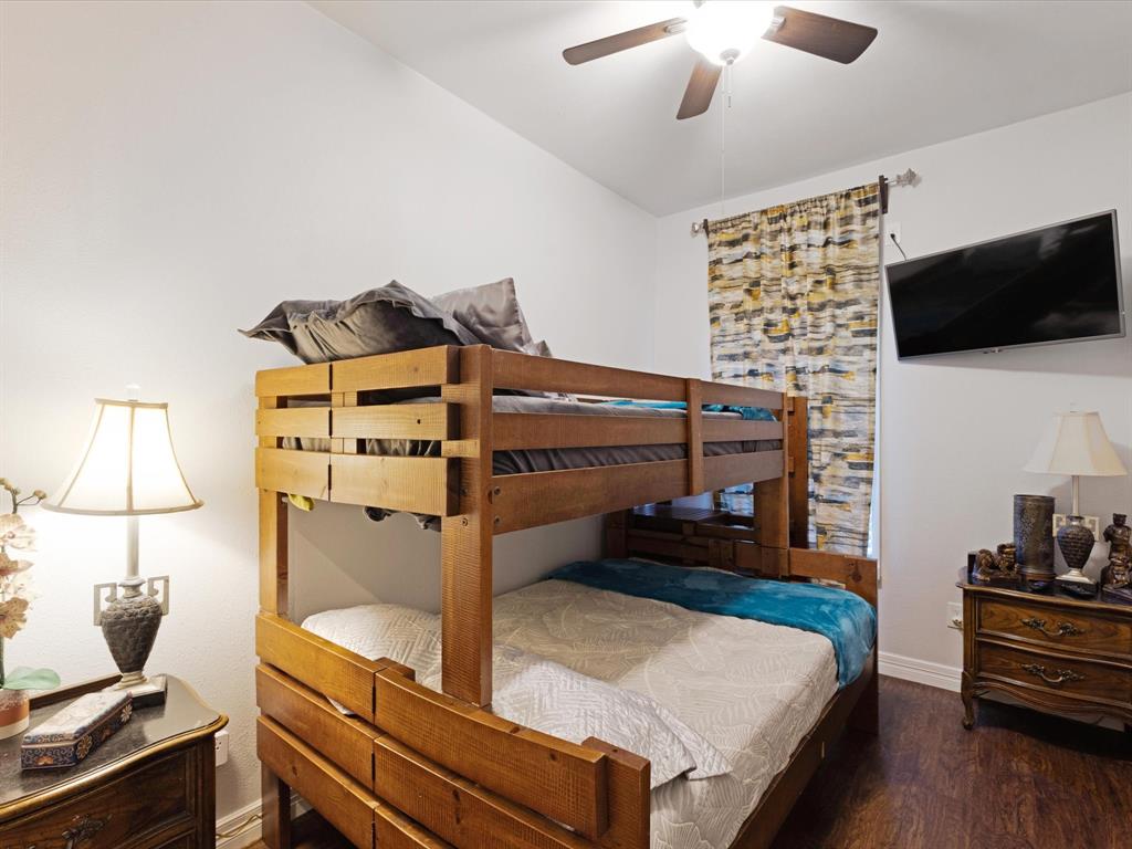 222 North Cliff Street Dallas, TX 75203 - Photo 13 of 14 a living room with furniture and a flat screen tv