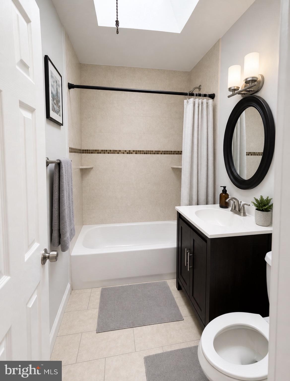 3129 Comly Road Philadelphia, PA 19154 - Photo 7 of 7 a bathroom with a sink a toilet and a mirror