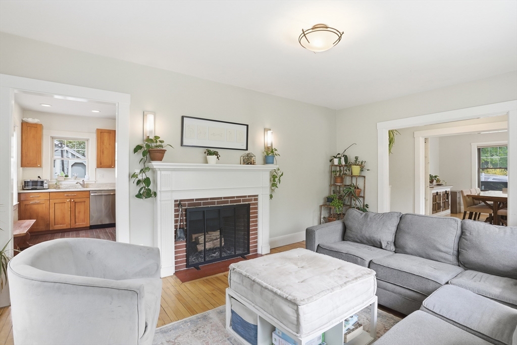 80 Concord Street Maynard, MA 01754 - Photo 4 of 29 a living room with furniture and a fireplace